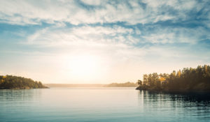 image of a lake and forest for paying for the funeral page